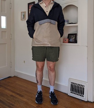 Black and White Athletic Shoes Outfits For Men: This laid-back pairing of a multi colored windbreaker and olive shorts is ideal if you want to go about your day with confidence in your ensemble. Unimpressed with this outfit? Invite a pair of black and white athletic shoes to change things up a bit.