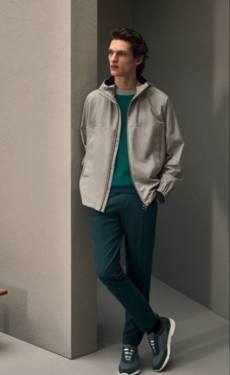 Dark Green Sweatshirt Outfits For Men: Stand out among other gentlemen by opting for a dark green sweatshirt and teal chinos. You can get a little creative in the footwear department and dial down your look by sporting a pair of dark green athletic shoes.