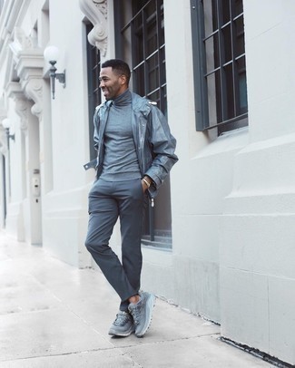 Grey Windbreaker Outfits For Men: Consider wearing a grey windbreaker and charcoal chinos for a laid-back kind of elegance. And if you want to effortlessly tone down this getup with one piece, why not complement this look with grey athletic shoes?