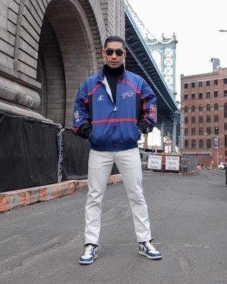 Navy Print Windbreaker Outfits For Men: You're looking at the indisputable proof that a navy print windbreaker and white jeans look awesome when combined together in a casual look. Let your sartorial credentials truly shine by rounding off this ensemble with a pair of white and navy leather low top sneakers.