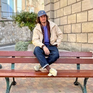 Tan Windbreaker Outfits For Men: If you feel more confident in practical clothes, you'll like this casual combo of a tan windbreaker and navy jeans. On the shoe front, go for something on the more elegant end of the spectrum by rounding off with a pair of beige suede desert boots.