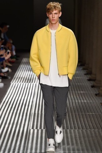 Yellow Bomber Jacket Outfits For Men: You'll be surprised at how very easy it is for any man to get dressed this way. Just a yellow bomber jacket married with charcoal chinos. Complement your getup with white and black athletic shoes for a fashionable hi-low mix.