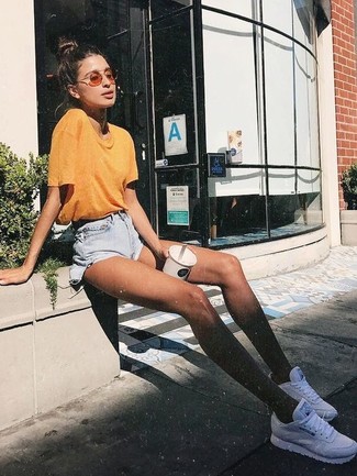 Yellow Crew-neck T-shirt Outfits For Women: A yellow crew-neck t-shirt looks especially cool when teamed with light blue denim shorts in a casual look. When this look looks all-too-perfect, play it down by rocking white athletic shoes.