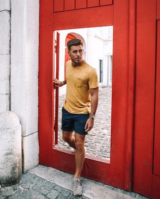 Green-Yellow Crew-neck T-shirt Outfits For Men: Go for a straightforward but at the same time cool and casual ensemble by combining a green-yellow crew-neck t-shirt and navy shorts. Grey athletic shoes add a more casual aesthetic to the look.