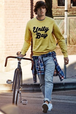 Men's Yellow Print Sweatshirt, White and Red and Navy Plaid Long Sleeve Shirt, Light Blue Jeans, White Canvas Low Top Sneakers