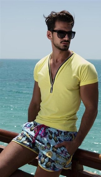 Aquamarine Shorts Outfits For Men: Dress in a yellow v-neck t-shirt and aquamarine shorts to achieve new levels in menswear styling.