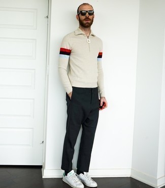 White and Green Leather Low Top Sneakers Outfits For Men: Extremely dapper, this casual combo of a beige zip neck sweater and black chinos will provide you with endless styling possibilities. And if you want to effortlessly play down this look with footwear, why not complement this outfit with a pair of white and green leather low top sneakers?
