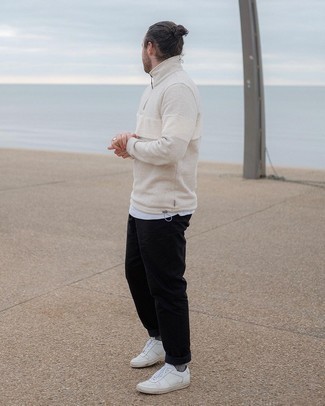 Black Chinos Outfits: Teaming a beige zip neck sweater with black chinos is a good choice for an off-duty ensemble. Our favorite of an infinite number of ways to finish this getup is with a pair of white leather low top sneakers.