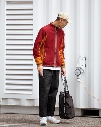 Bag Outfits For Men: For an outfit that's super easy but can be manipulated in a ton of different ways, reach for a red fleece zip neck sweater and a bag. This getup is rounded off perfectly with white athletic shoes.