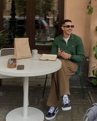 Brown Chinos Outfits: A dark green zip neck sweater and brown chinos are essential menswear pieces, without which no closet would be complete. A trendy pair of black and white canvas high top sneakers is the most effective way to inject a hint of stylish nonchalance into this outfit.
