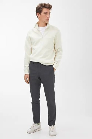 White Zip Neck Sweater Outfits For Men: Choose a white zip neck sweater and charcoal chinos to assemble a laid-back and cool getup. Finishing with a pair of white athletic shoes is the simplest way to bring a dash of stylish effortlessness to your look.