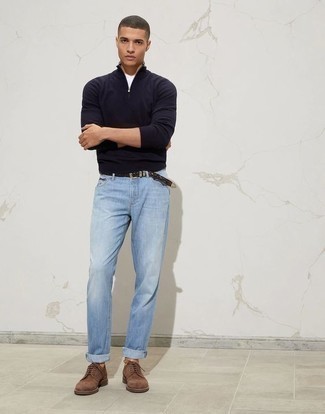 Light Blue Jeans Outfits For Men: This casual combo of a navy zip neck sweater and light blue jeans takes on different moods depending on how it's styled. Let your outfit coordination sensibilities truly shine by finishing your ensemble with a pair of brown suede derby shoes.