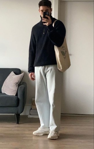 Beige Athletic Shoes Outfits For Men: For a fail-safe relaxed casual option, you can't go wrong with this combo of a black zip neck sweater and white jeans. Rounding off with beige athletic shoes is an effortless way to infuse a mellow feel into this look.