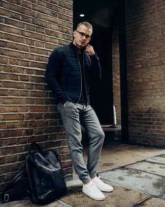 Navy Quilted Zip Sweater Outfits For Men: Extremely stylish and comfortable, this off-duty pairing of a navy quilted zip sweater and grey wool chinos delivers amazing styling opportunities. Complete your look with a pair of white canvas low top sneakers and off you go looking smashing.