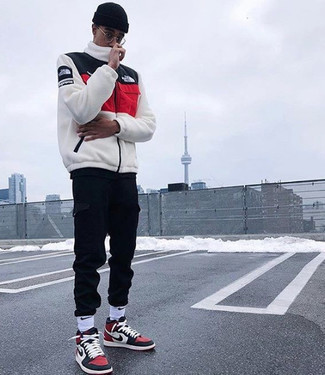 White Zip Sweater Outfits For Men: A white zip sweater and black cargo pants are the kind of casual essentials that you can wear a hundred of ways. For a more laid-back twist, why not complete this look with a pair of white and red and navy canvas high top sneakers?