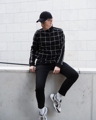 White and Black Athletic Shoes Outfits For Men: This casual combo of a black check zip sweater and black chinos is a fail-safe option when you need to look cool but have no extra time. Add a pair of white and black athletic shoes to this getup to make an all-too-safe look feel suddenly fun and fresh.