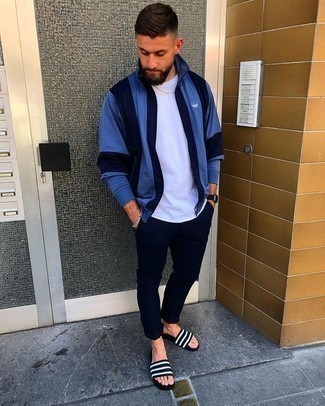 Black Flip Flops Outfits For Men: For a casual and cool ensemble, pair a blue zip sweater with navy chinos — these pieces play really well together. Finishing with a pair of black flip flops is a simple way to introduce a more casual aesthetic to your ensemble.
