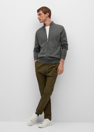 Charcoal Zip Sweater Outfits For Men: This combination of a charcoal zip sweater and olive chinos delivers comfort and utility and helps you keep it low-key yet current. If you wish to easily dress down your look with footwear, add a pair of white canvas low top sneakers to the equation.