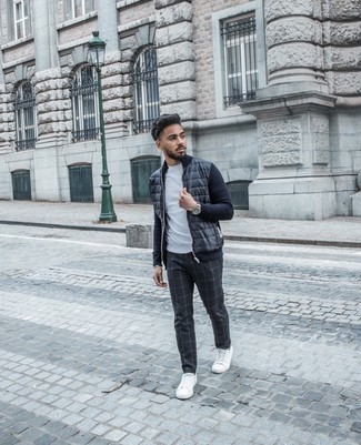 Black Plaid Chinos Outfits: Teaming a navy quilted zip sweater with black plaid chinos is an amazing option for a casual but sharp ensemble. White canvas low top sneakers will be the ideal complement for this look.