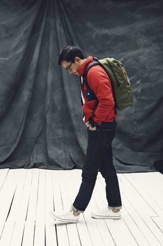 Backpack Outfits For Men: A red fleece zip sweater and a backpack are a go-to casual pairing for many sartorial-savvy guys. Feeling transgressive today? Spice things up by slipping into white canvas low top sneakers.