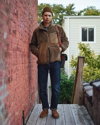 Brown Fleece Zip Sweater Outfits For Men: For a foolproof off-duty option, you can rely on this combination of a brown fleece zip sweater and navy jeans. Complete this look with brown suede desert boots and the whole look will come together.