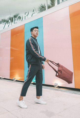 Brown Canvas Tote Bag Outfits For Men: This modern casual combo of a charcoal vertical striped zip sweater and a brown canvas tote bag can only be described as seriously dapper. Clueless about how to complement this outfit? Rock white leather low top sneakers to amp up the wow factor.