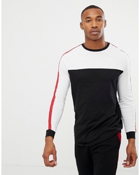 ASOS DESIGN Longline Long Sleeve T Shirt With Curved Hem And Contrast Yoke In Black