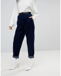 ASOS DESIGN Tapered Jeans With Curved Seams And Belt In Indigo Wash
