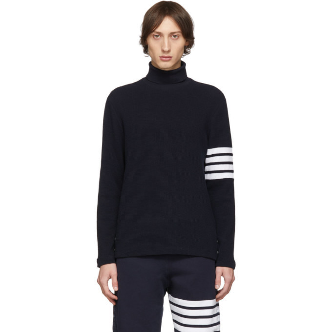 Thom Browne Navy 4 Bar Waffle Knit Turtleneck, $454 | SSENSE