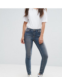 Asos Tall Lisbon Skinny Mid Rise Jeans In Dita Tinted Mid Wash With Reverse Stepped Hem