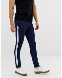 ASOS DESIGN Super Skinny Jeans With White Stripe In Indigo