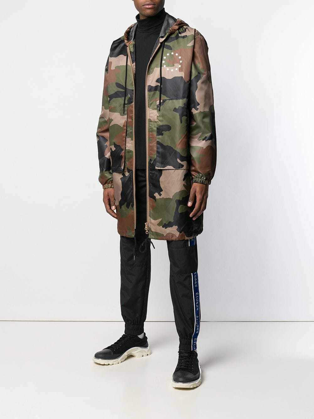 Études Air Europa Camouflage Parka, $215 | farfetch.com | Lookastic