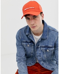 ASOS DESIGN Baseball Cap In Red With Rubber Badge Detail