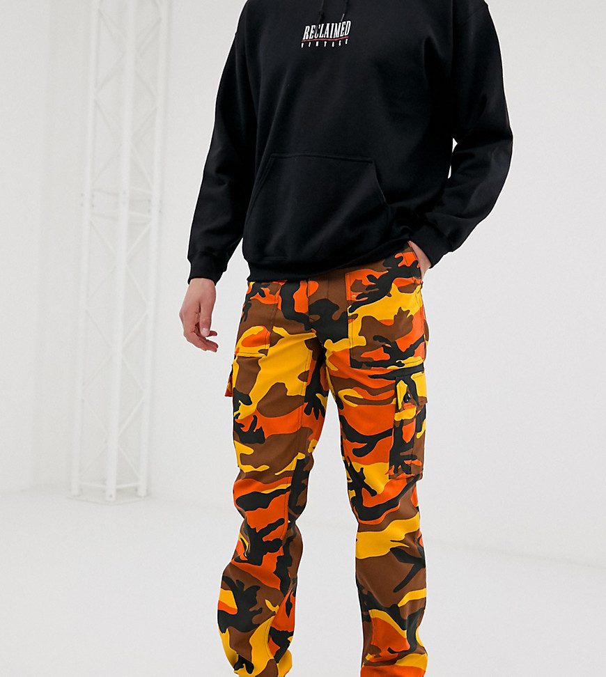 Reclaimed Vintage Revived Camo Cargo Trousers In Orange, $42