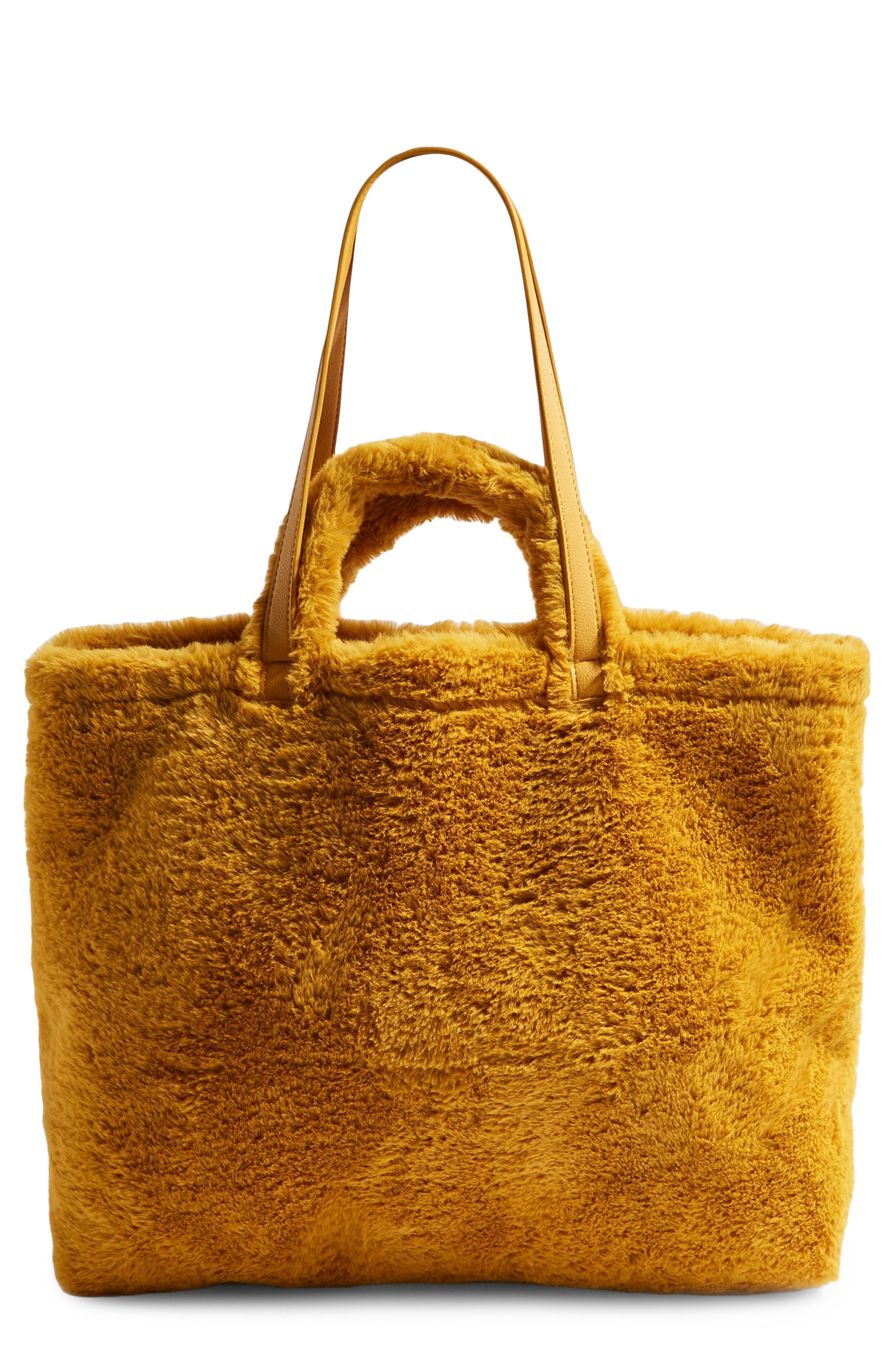 Topshop Finley Reversible Faux Fur Tote Bag, $30 | Nordstrom
