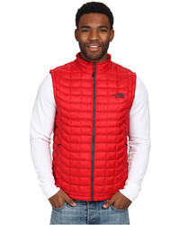 red and black north face gilet