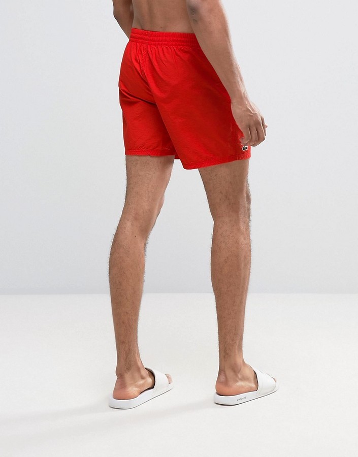red lacoste swim shorts