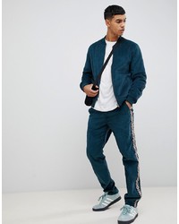 ASOS DESIGN Co Ord Slim Trousers In Teal Cord With Aztec Side Taping