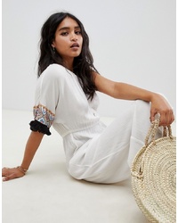 ASOS DESIGN Embroidered Fringed Tape One Shoulder Beach Jumpsuit In White