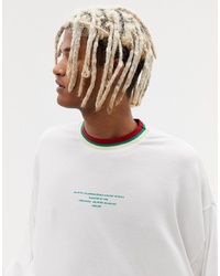 ASOS DESIGN Oversized Long Sleeve T Shirt With Small Text Print And Tipped Rib