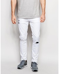 Asos Brand Skinny Jeans In White With Rip And Repair Indigo Patches