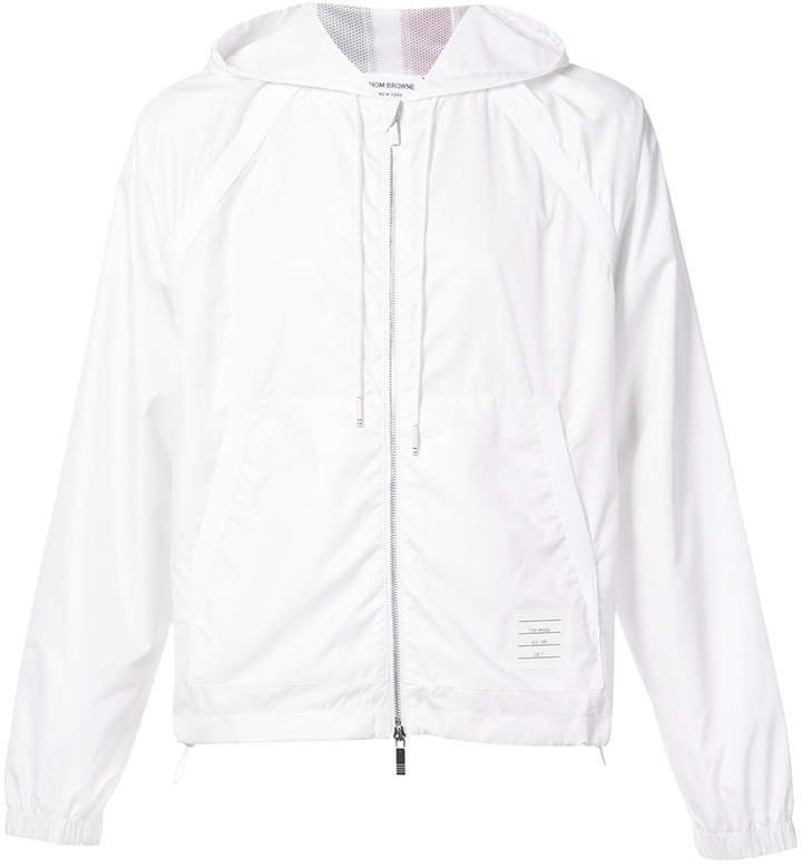 white zip up windbreaker